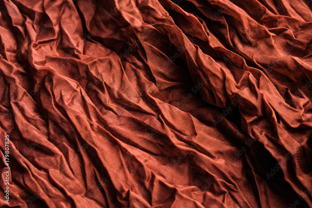 The texture of the copper pleated fabric. Brown georgette fabrics. The texture of the copper pleated fabric. Brown georgette fabrics.