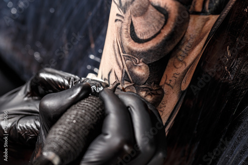 Close up tattoo artist