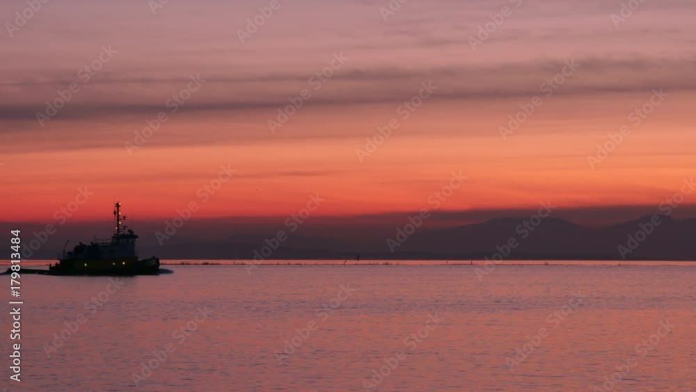 Fraser River Sunset Tug zoom, Richmond BC 4K UHD. A tugboat heading out into Georgia Strait at sunset. British Columbia, Canada, near Vancouver. 4K. UHD.
Fraser River Sunset Tug zoom, Richmond BC 4K UHD. A tugboat heading out into Georgia Strait at sunset. British Columbia, Canada, near Vancouver. 4K. UHD.