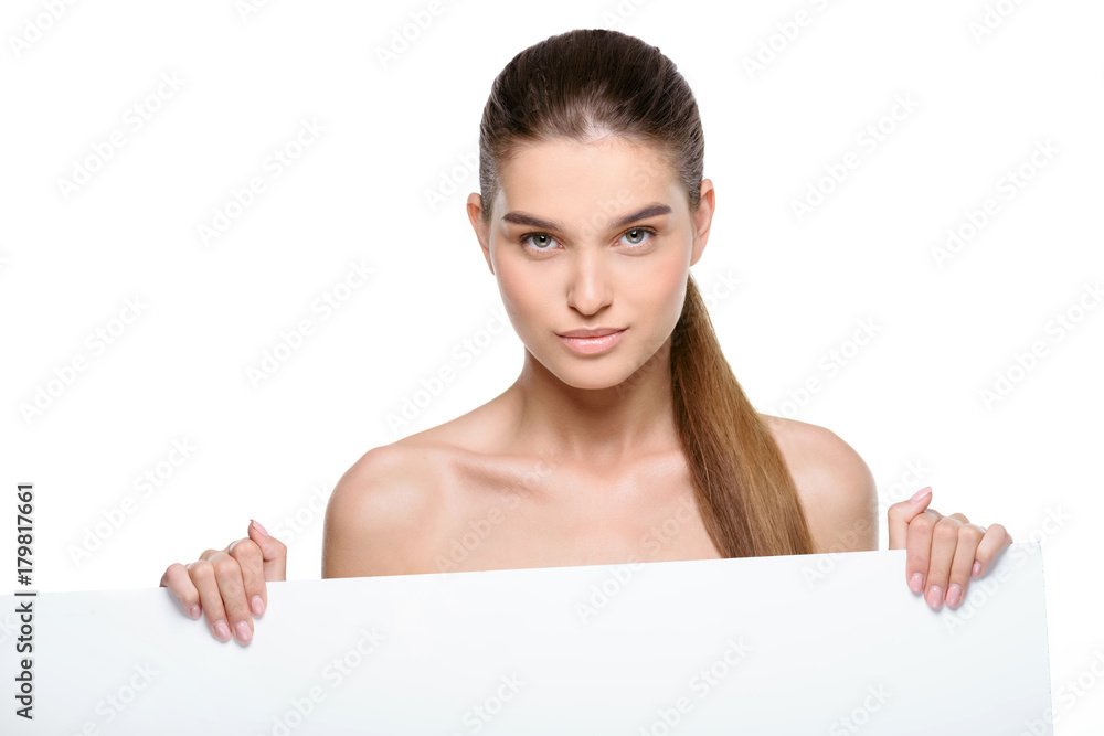 Beautiful woman holding a blank billboard Beautiful woman holding a blank billboard