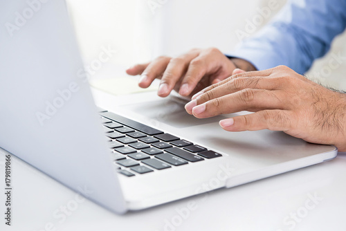 Businessman using laptop computer working and searching for information