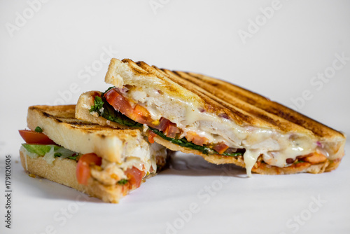 grilled chicken panini with tomato isolated on white