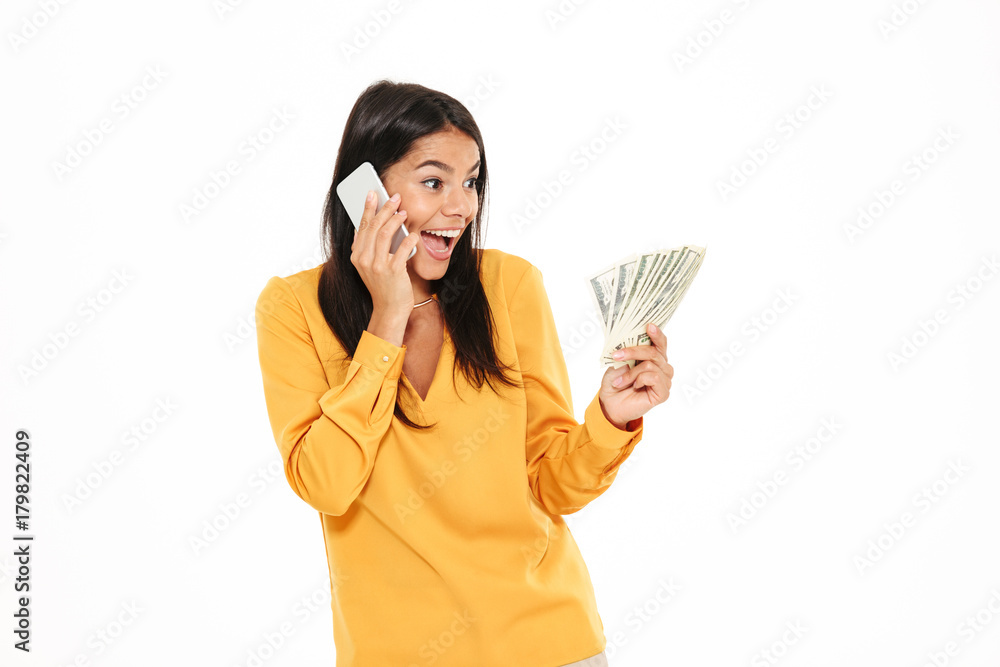 Portrait of a joyful surprised woman talking on mobile phone Portrait of a joyful surprised woman talking on mobile phone