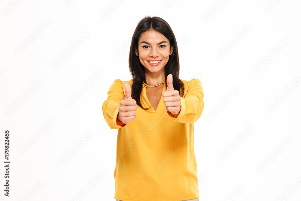 Portrait of happy confident woman showing thumbs up gesture Portrait of happy confident woman showing thumbs up gesture