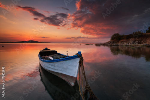 Lonely boat at sunset © Ivan