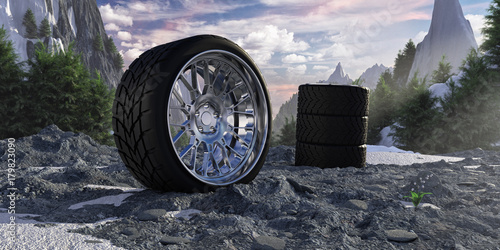 Winter tires in snowy mountains. The concept of car service and tire fitting