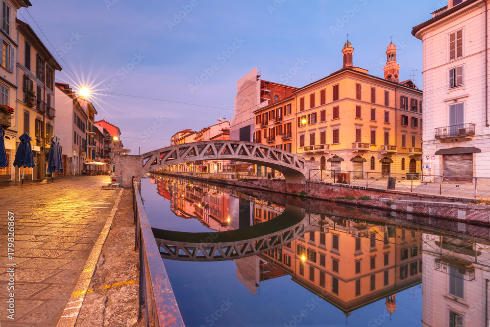 Bridge across the Naviglio Grande canal during morning blue hour, Milan, Lombardia, Italy