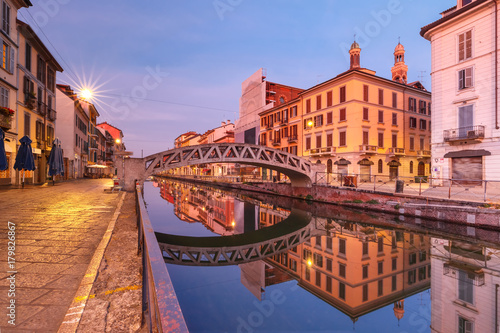Bridge across the Naviglio Grande canal during morning blue hour, Milan, Lombardia, Italy photo