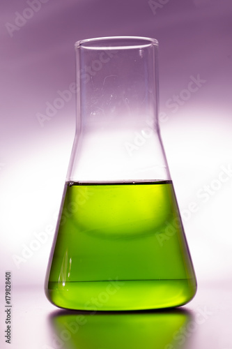 Retort for chemical experiments with yellow liquid