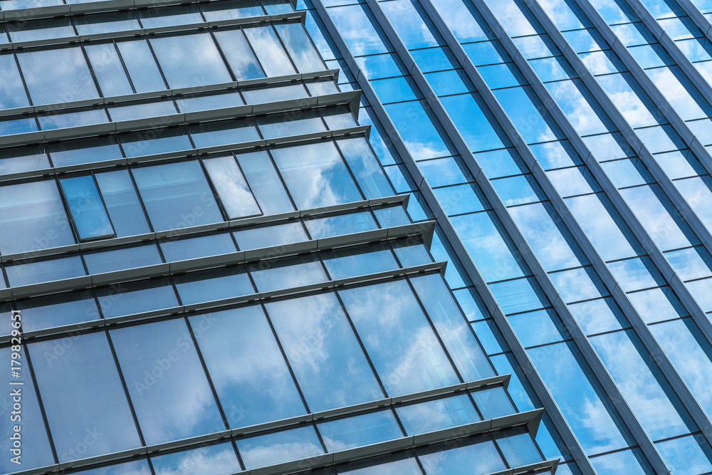 Clouds Reflected in Windows of Modern Office Building..