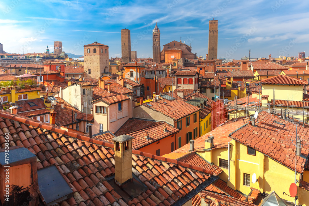 Fototapeta premium Aerial view of Bologna Cathedral and towers towering above of the roofs of Old Town in medieval city Bologna in the sunny day, Emilia-Romagna, Italy