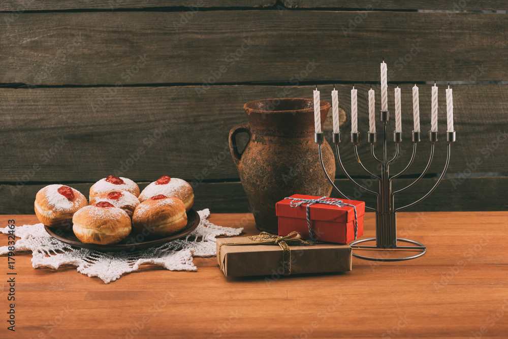 menorah, gifts and donuts for hanukkah