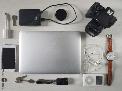 Travel personal belongings, a computer and other objects photo