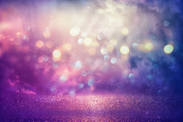 Purple glitter lights background. defocused.