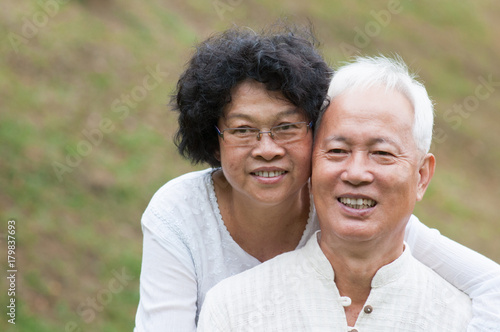 Elderly Asian couple relaxing outdoor. © WONG SZE FEI
