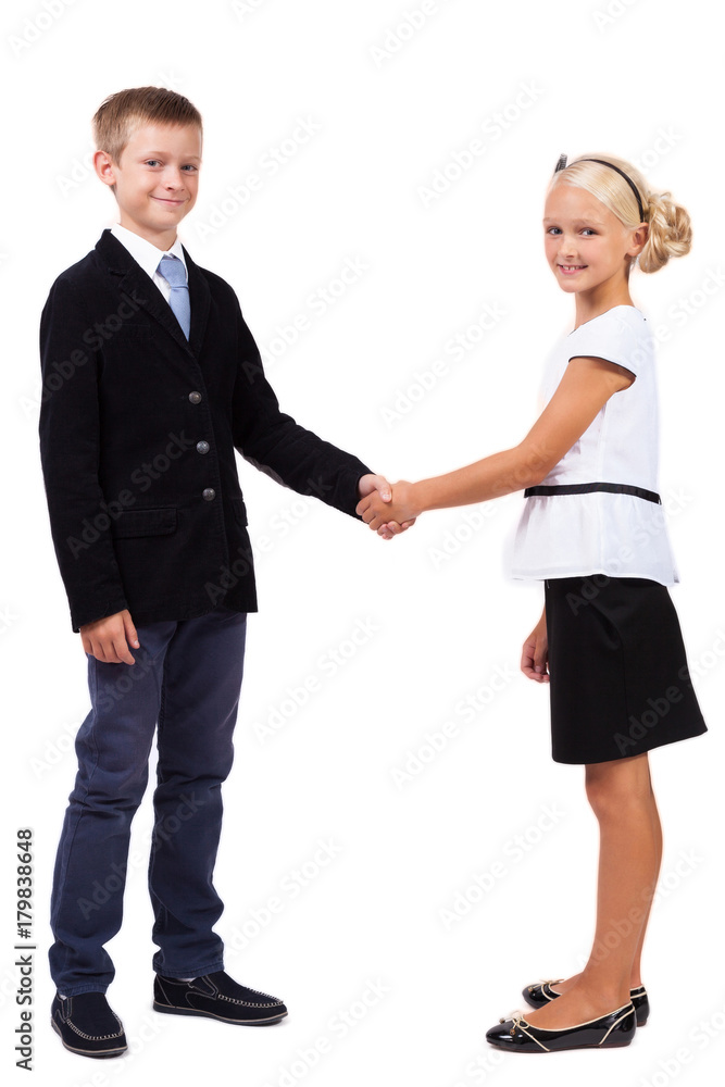 Students in business suits on a white background shake hands Students in business suits on a white background shake hands