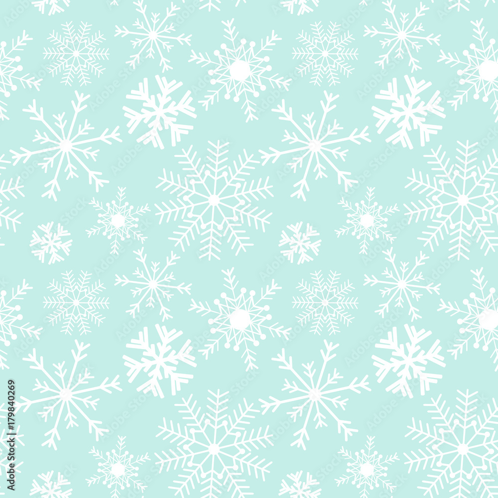 Seamless snowflake Christmas pattern on a blue background.