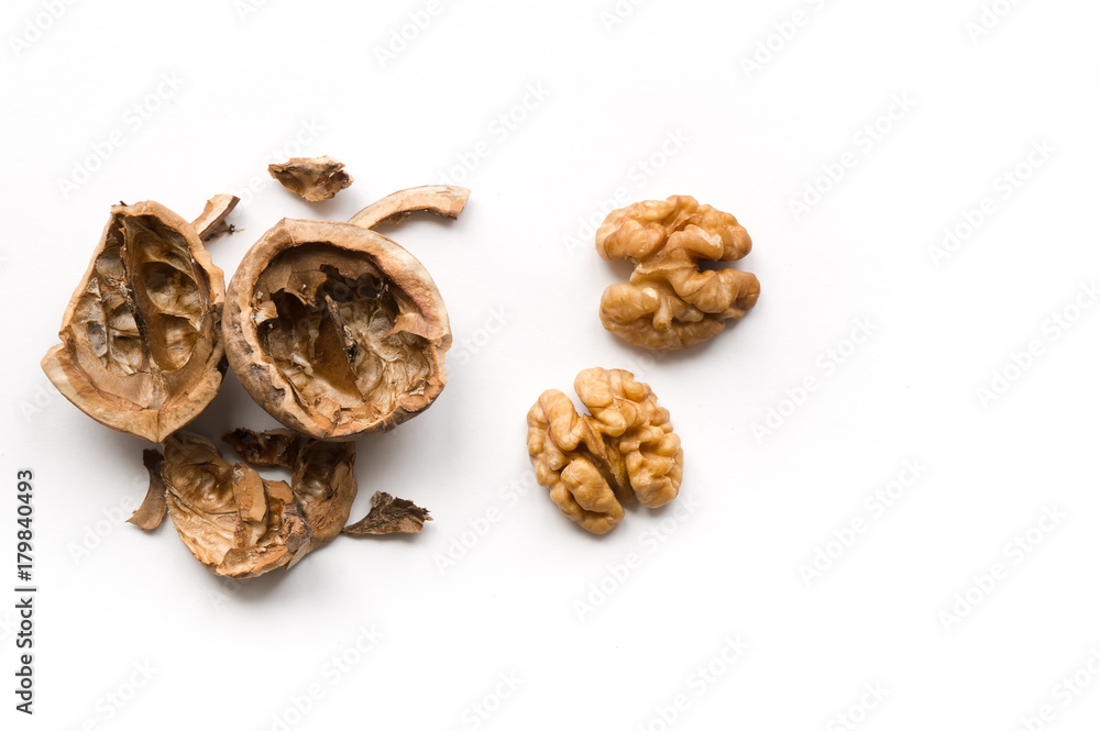 Isolated walnuts on white background.  Top view. Cracked shell. 