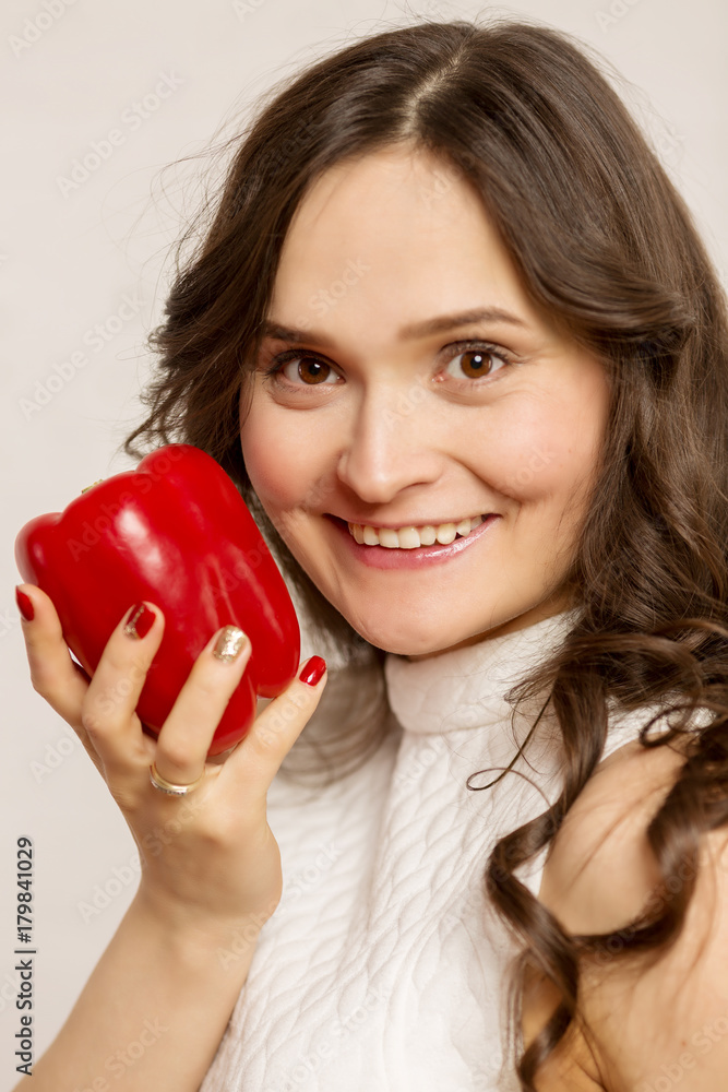 Young beautiful woman, brunette, with fruit in hands Young beautiful woman, brunette, with fruit in hands