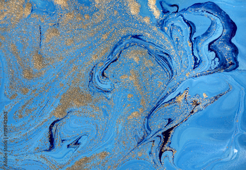Marbled blue abstract background with golden sequins. Liquid marble ink pattern. Marbled blue abstract background with golden sequins. Liquid marble ink pattern.