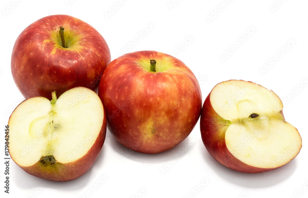 Red Kanzi apples, two whole, two halves, isolated on white background