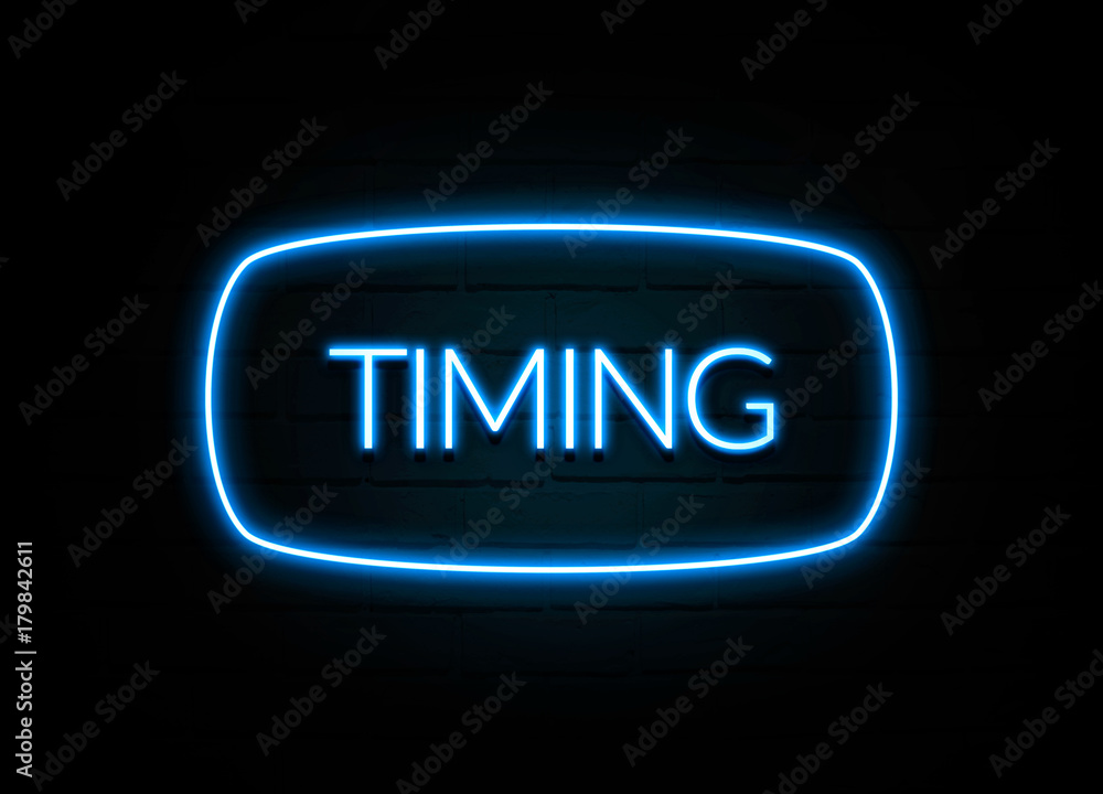 Timing - colorful Neon Sign on brickwall Timing - colorful Neon Sign on brickwall