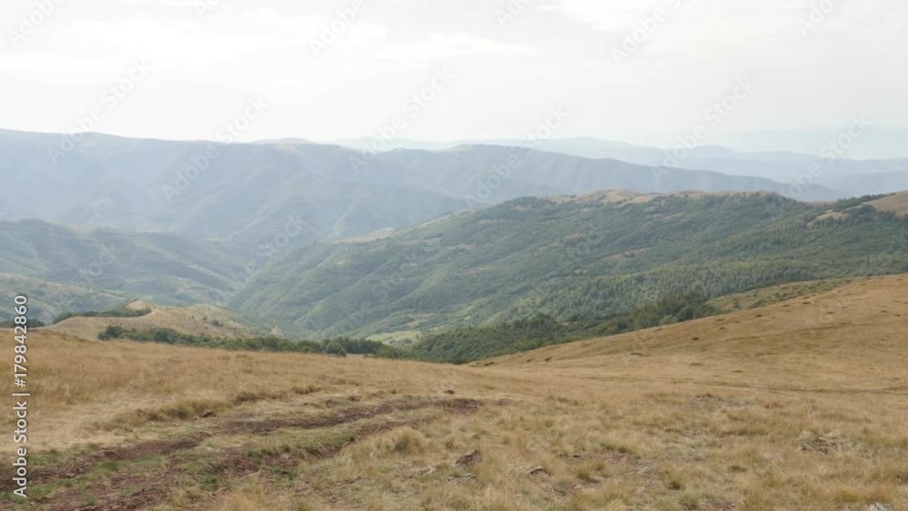 Slow tilt on Midzor peak valley by the day footage - Mountain ranges and beautiful nature of Stara planina Slow tilt on Midzor peak valley by the day footage - Mountain ranges and beautiful nature of Stara planina
