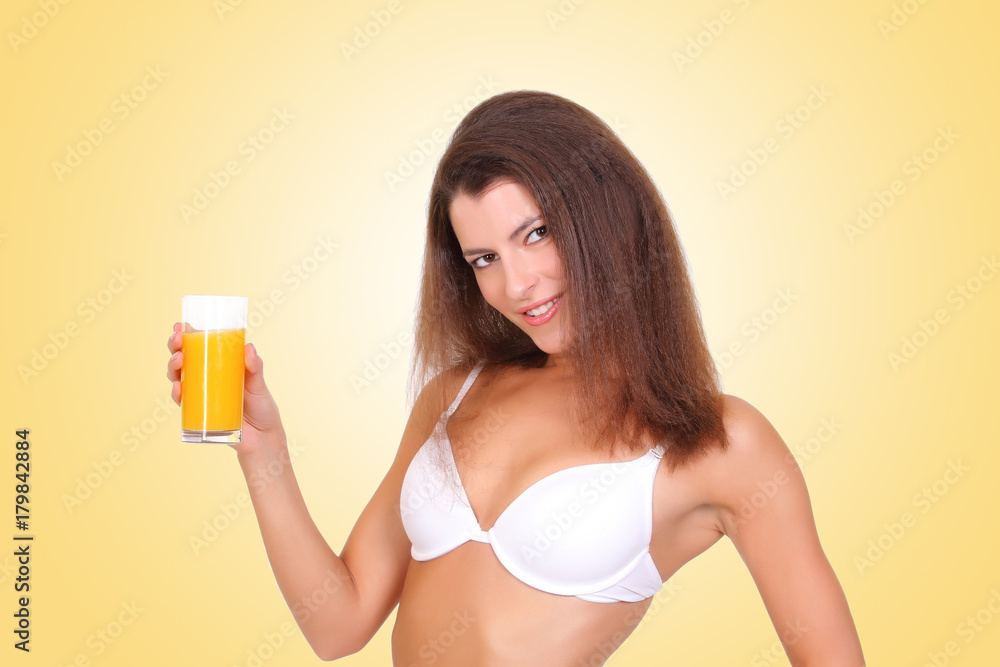 in underwear with a glass of orange juice in underwear with a glass of orange juice