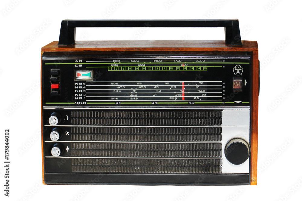 An old transistor radio portable model in a wooden case. Made in USSR. Most popular in the 70-80s. Isolated on white. letters on the left indicate the wavelengths long, medium, short, ultra short An old transistor radio portable model in a wooden case. Made in USSR. Most popular in the 70-80s. Isolated on white. letters on the left indicate the wavelengths long, medium, short, ultra short
