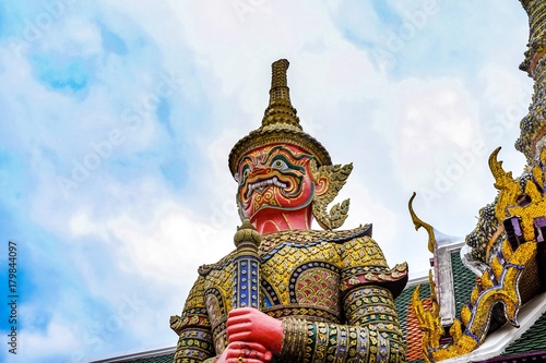 Wat Phra Kaew  or the Temple of the Emerald Buddha and Officially as Wat Phra Si Rattana Satsadaram  is regarded as the most sacred Buddhist temple in Bangkok Thailand symbol Giant statue.