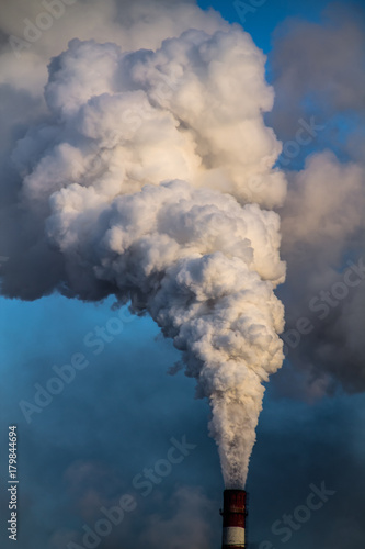 industrial chimney with heavy smoke causing pollution