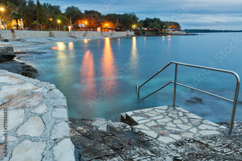 Fototapeta Naklejka Na Ścianę i Meble -  Mediterranean sumer resort with Adriatic sea beach at evening
