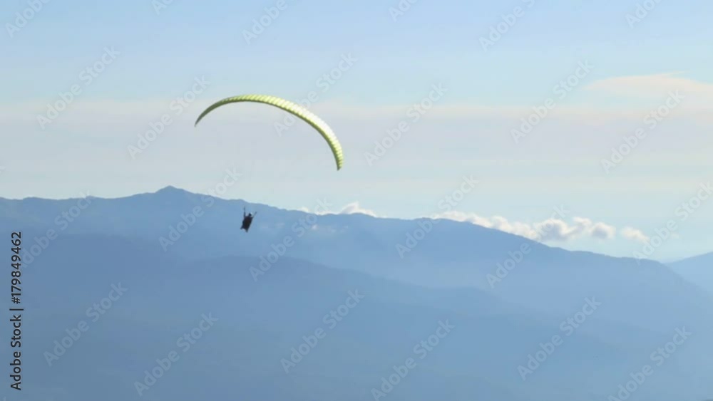 Following Parachute silhouette the mountains Following Parachute silhouette the mountains