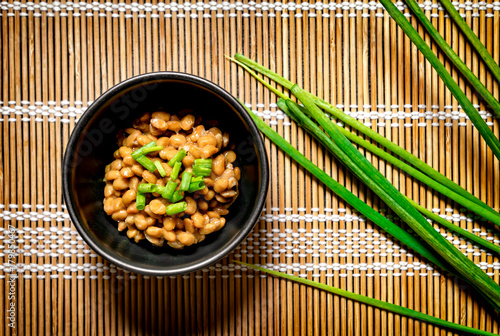 Traditional Japanese Fermented Beans Seasoned with Raw Green Onions for Breakfast . photo