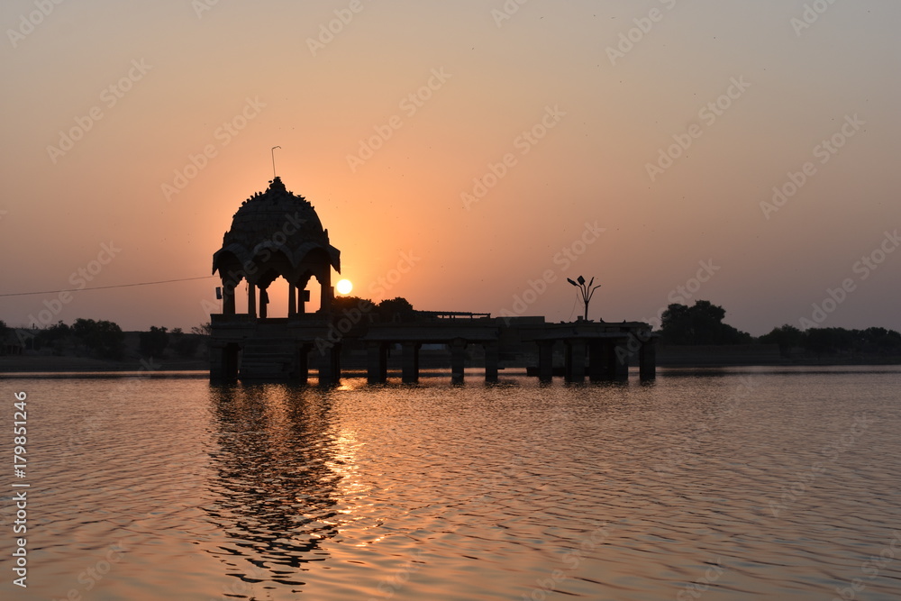 historical monument with sunrise in gadisar lake jaisalmer rajasthan india