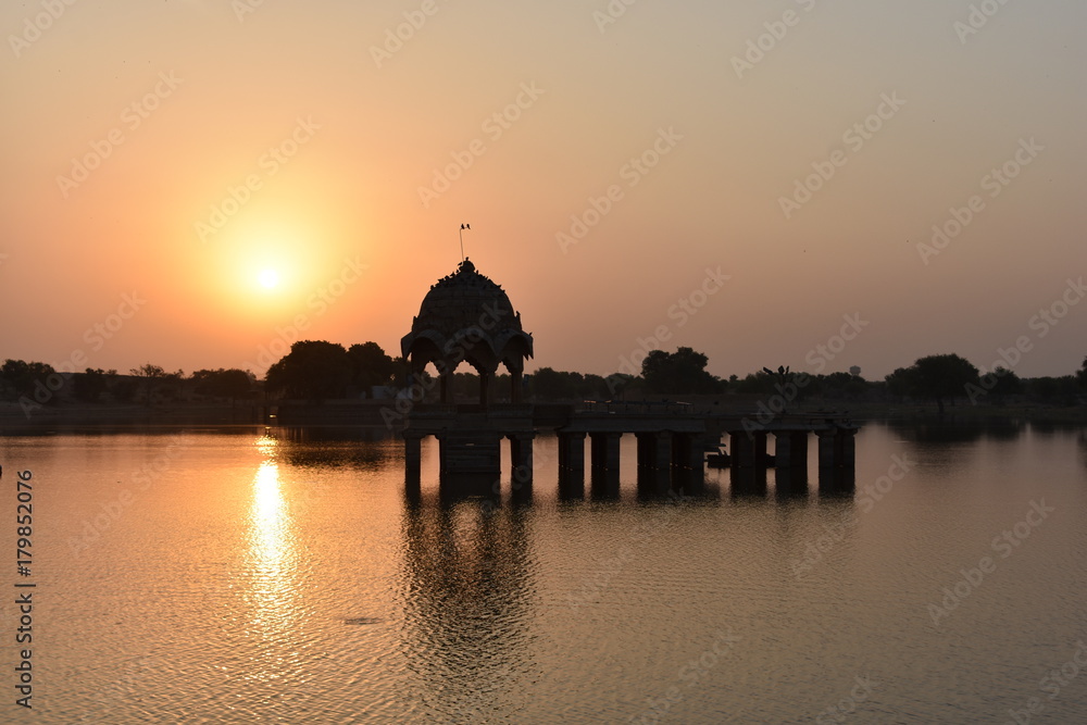 historical monument with sunrise in gadisar lake jaisalmer rajasthan india