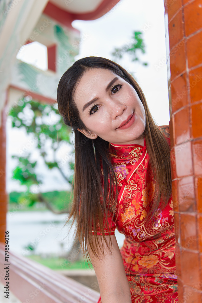 happy Chinese new year. Asian woman wearing traditional Cheongsam clothes portrait outdoor happy Chinese new year. Asian woman wearing traditional Cheongsam clothes portrait outdoor
