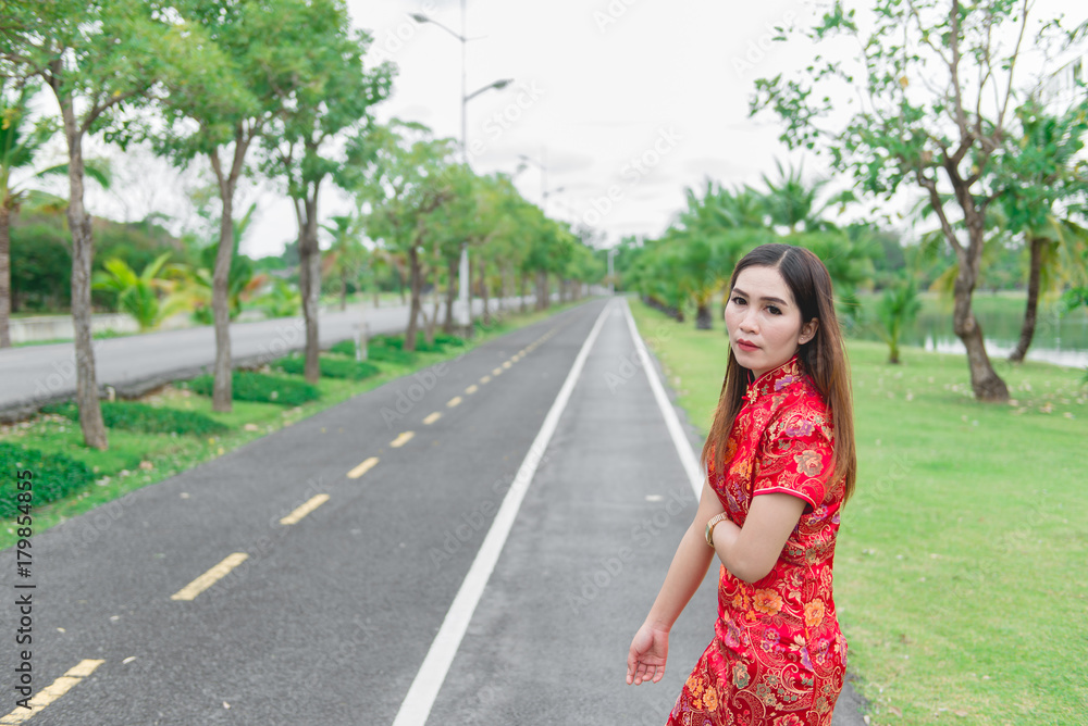happy Chinese new year. Asian woman wearing traditional Cheongsam clothes portrait outdoor happy Chinese new year. Asian woman wearing traditional Cheongsam clothes portrait outdoor