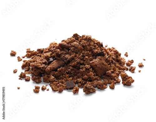 Crunchy granola, muesli pile with chocolate isolated on white background