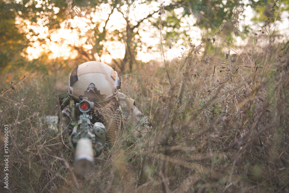 Soldiers with guns to ambush in the forest,soldier war concept Soldiers with guns to ambush in the forest,soldier war concept
