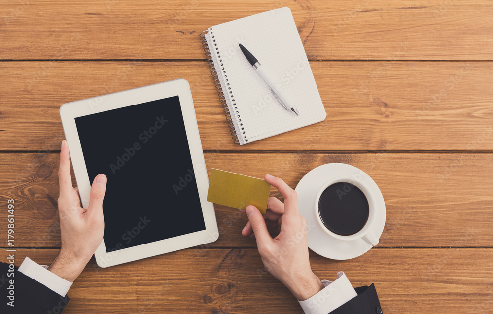 Businessman using credit card for online shopping Businessman using credit card for online shopping