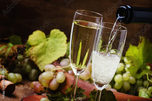Champagne Pour In Glass, Grapes With Vine, Vintage Wood Background, Selective Focus