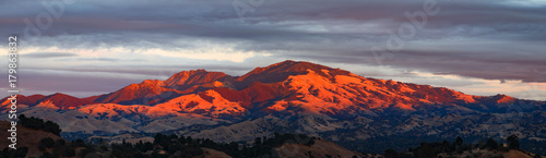 Mount Diablo California mountain panorama with setting sun and clouds