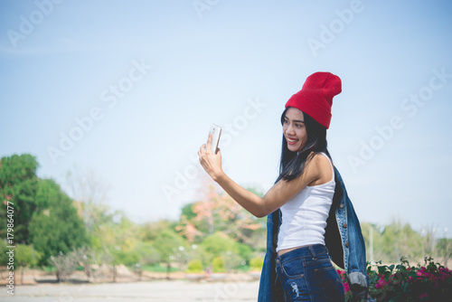 Asian teenage girl selfie fun in the park