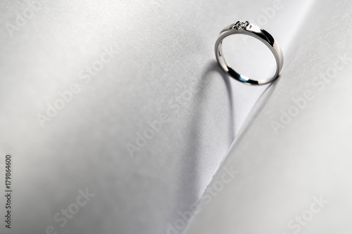 Close up of Platinum wedding Standing middel of two white paper and shadow look like a heart photo