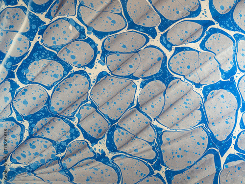 Marbled paper background.