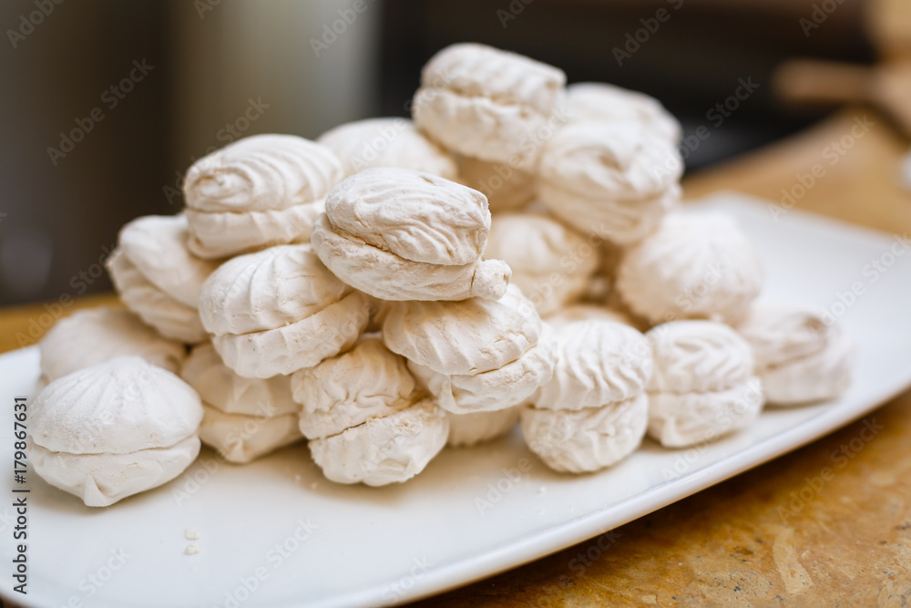 White sweet mini marshmallows in a bowl 