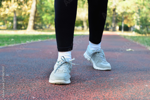 Recreation in the park during fall season - jogging and walking