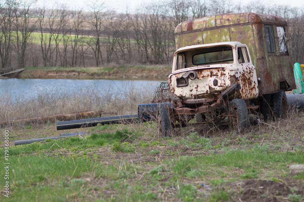 Battered old truck parked in the grass