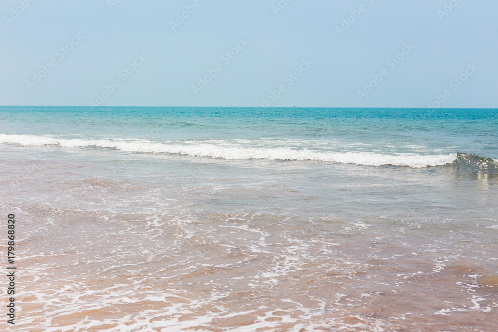View from a tropical sandy beach on sea turquoise with clear water in clear weather. View from a tropical sandy beach on sea turquoise with clear water in clear weather.